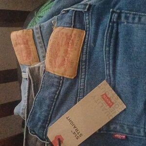 New never been worn Levi's 35×32 514's faded blue
